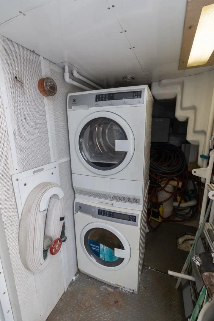 a white washing machine aboard CARPE DIEM Yacht for Charter