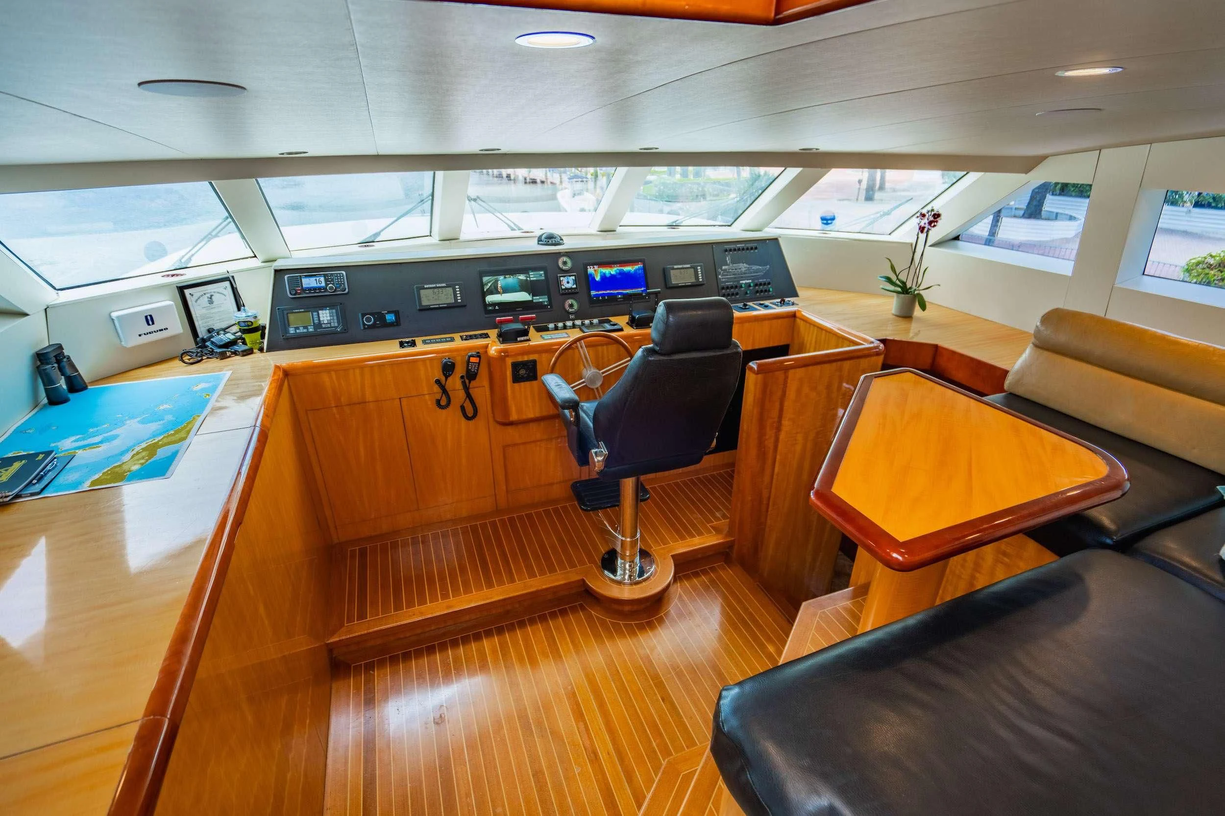 a room with a desk and chairs aboard CARPE DIEM Yacht for Charter