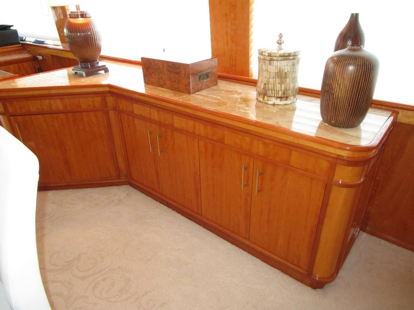 a wooden cabinet with vases on top aboard CARPE DIEM Yacht for Charter