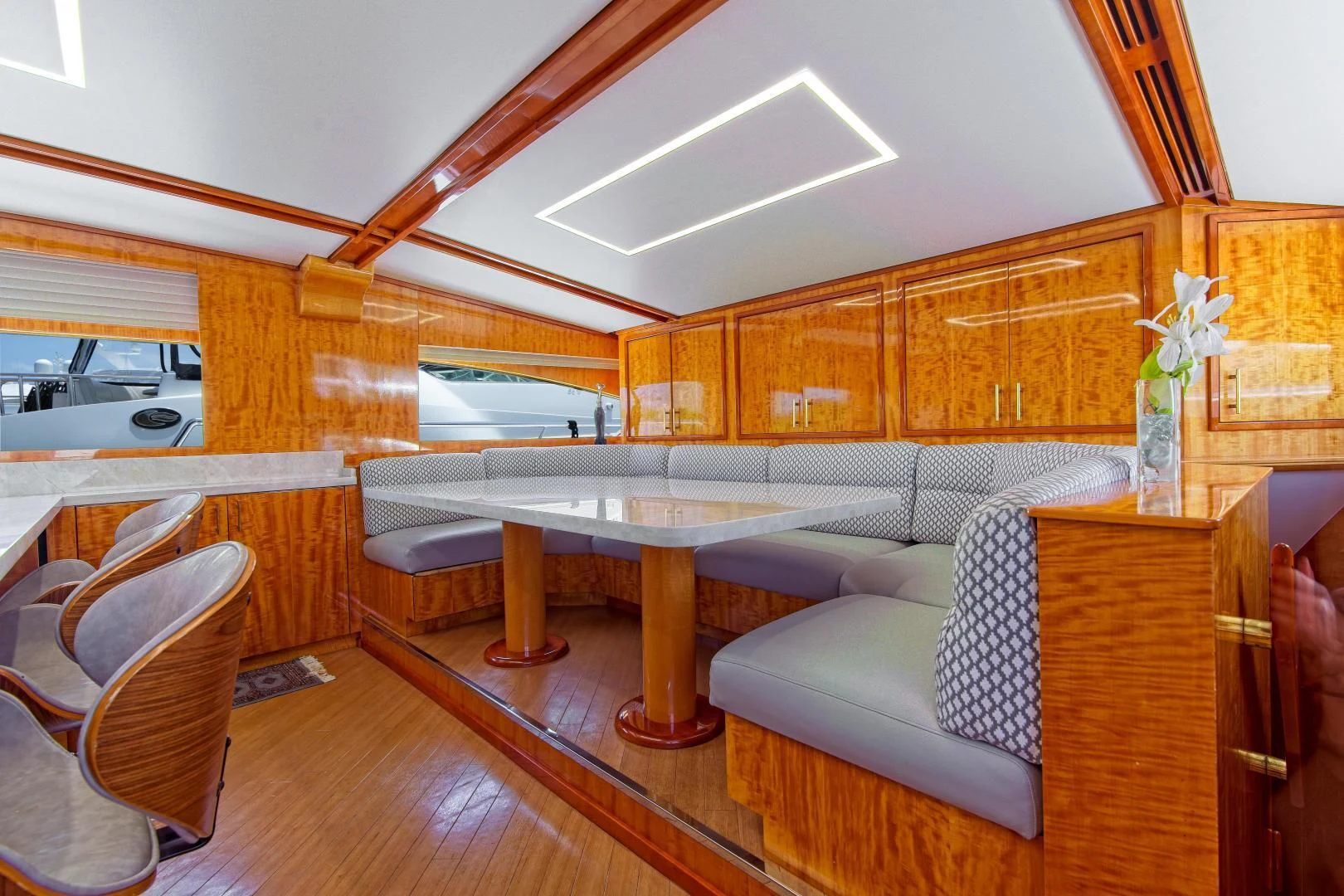 a living room with a couch and a table aboard CARPE DIEM Yacht for Charter
