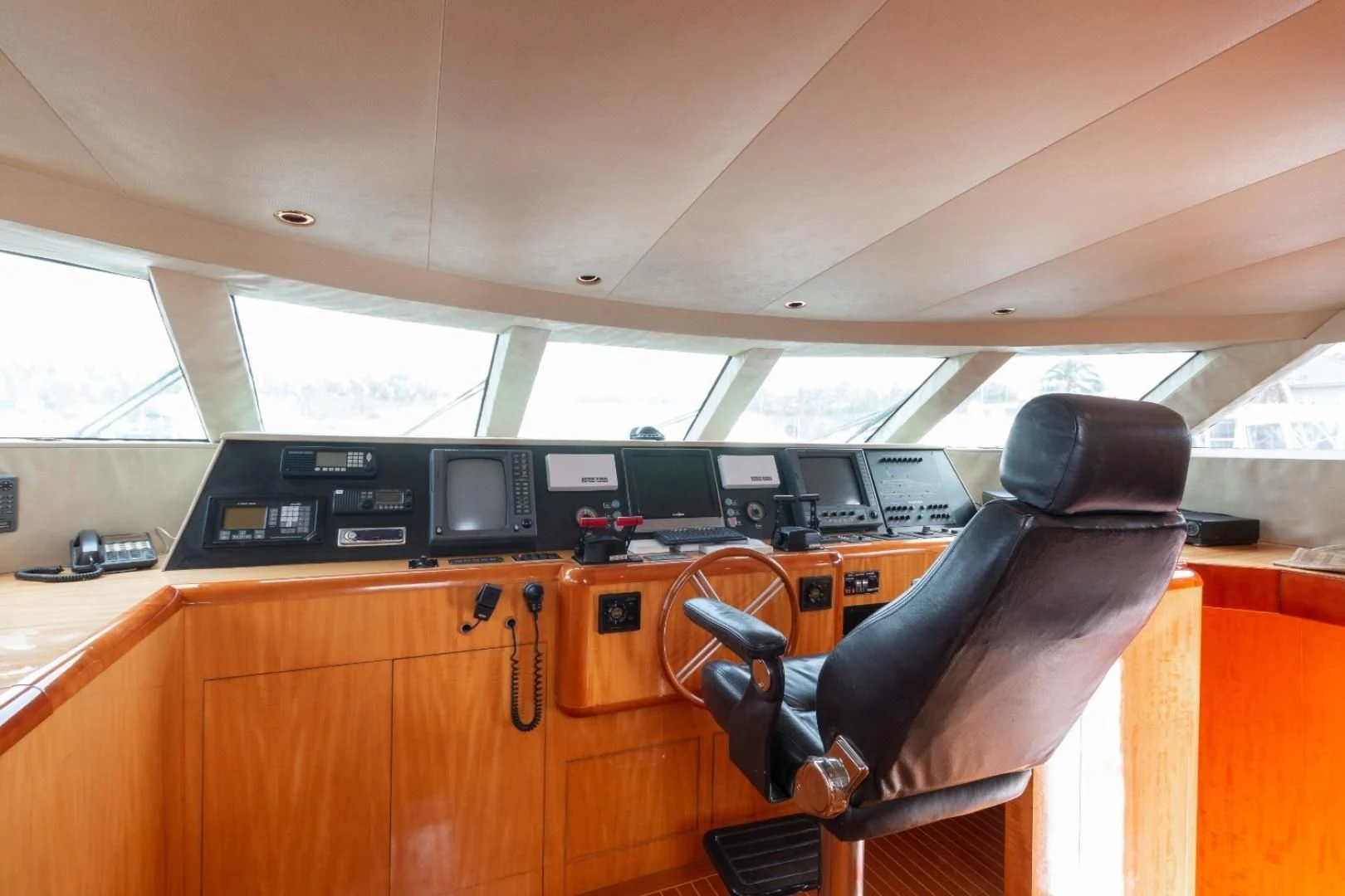 a room with a desk and chairs aboard CARPE DIEM Yacht for Charter