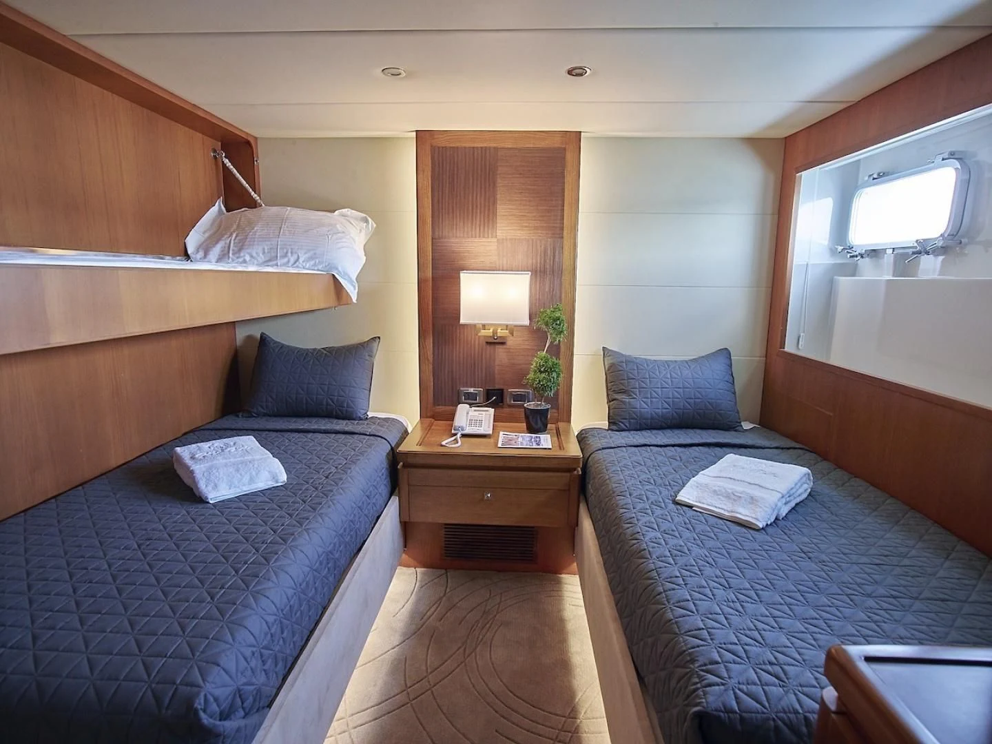 a couple of beds in a hotel room aboard ALAIA Yacht for Sale