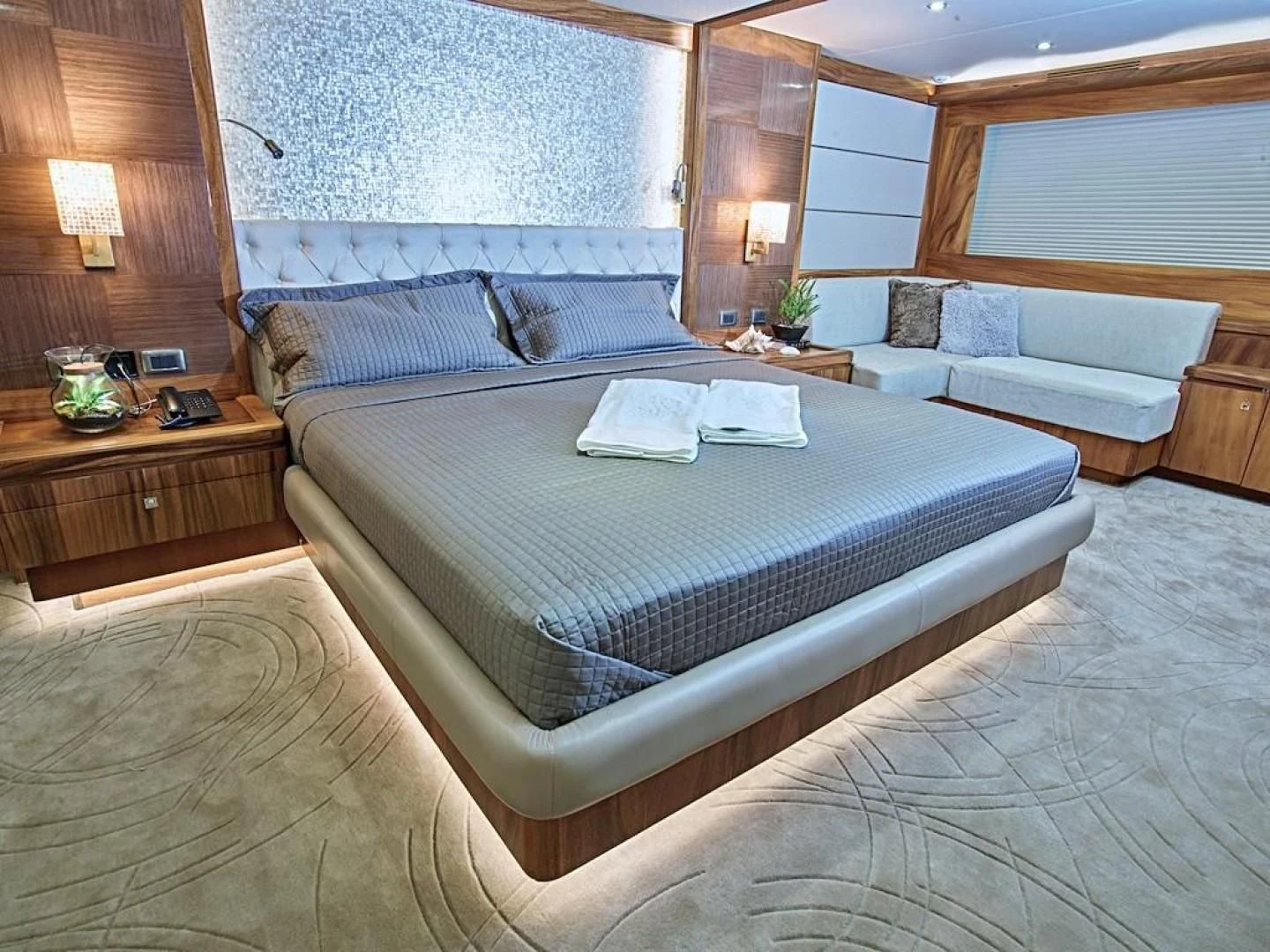 a large bed in a hotel room aboard ALAIA Yacht for Sale