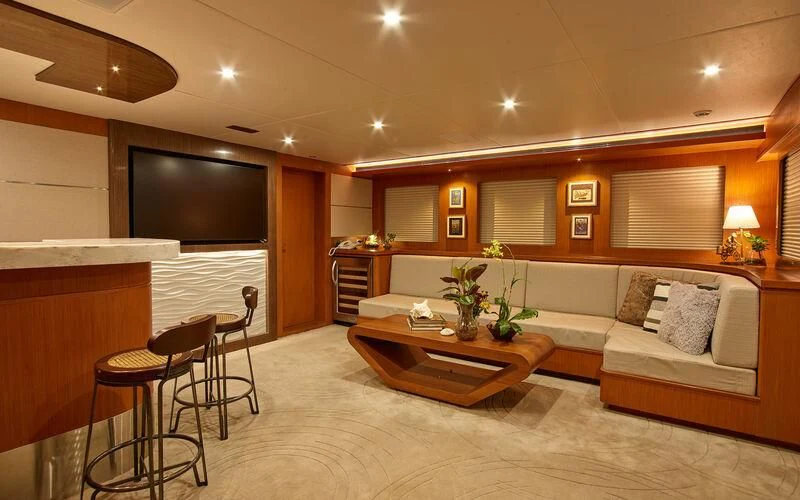 a living room with a couch and a table aboard ALAIA Yacht for Sale