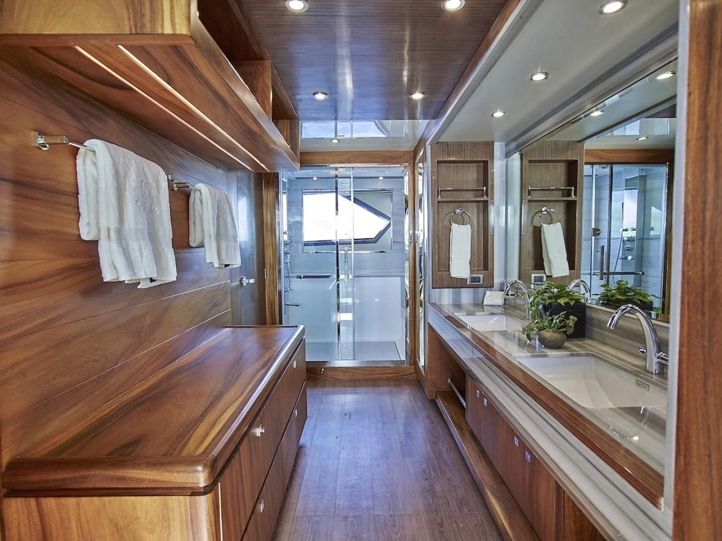 a bathroom with a wood floor aboard ALAIA Yacht for Sale