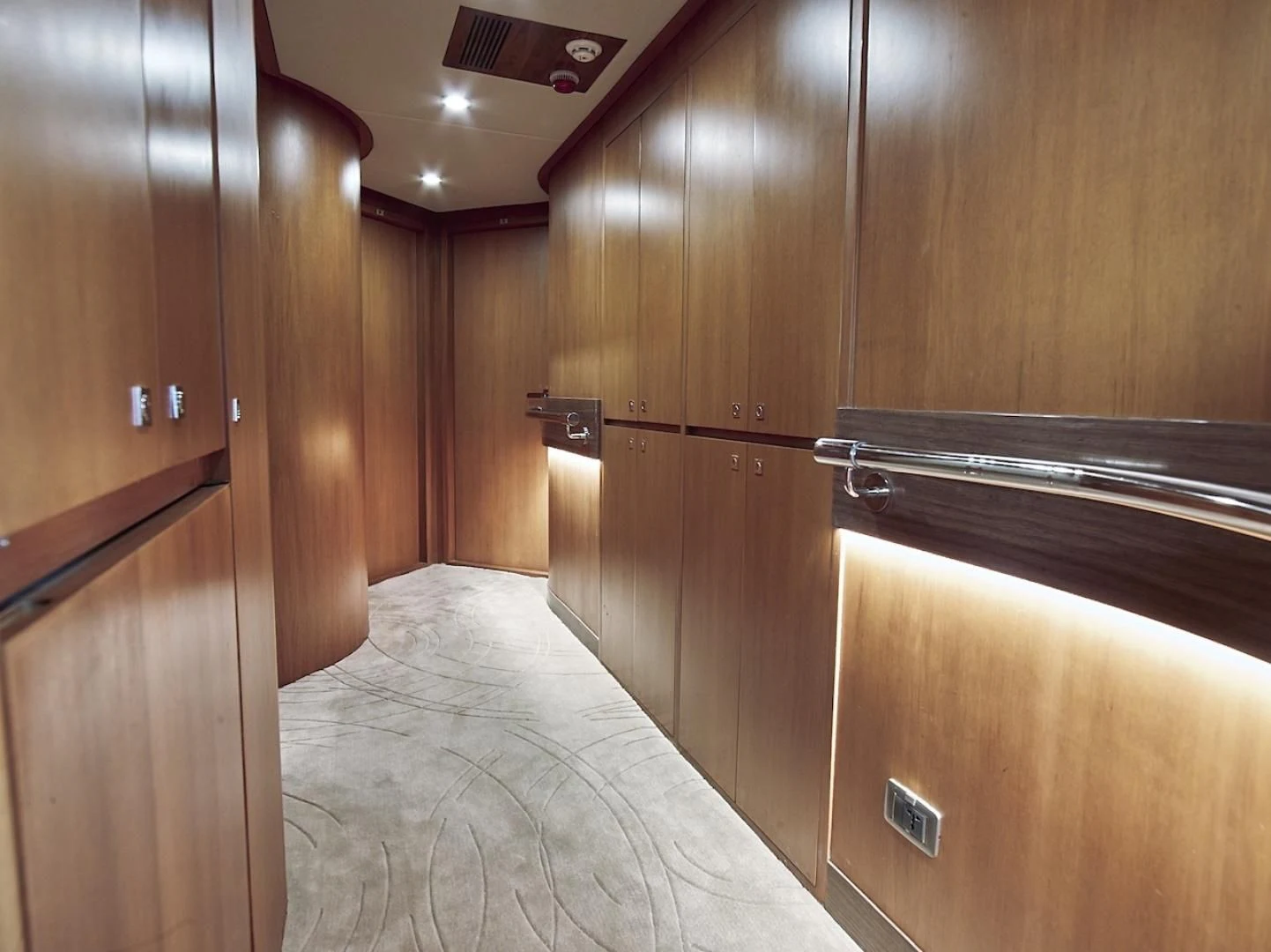 a room with wooden cabinets aboard ALAIA Yacht for Sale