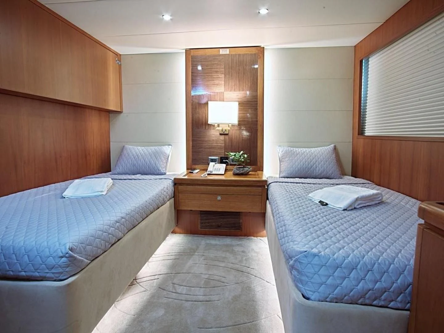 a room with two beds aboard ALAIA Yacht for Sale