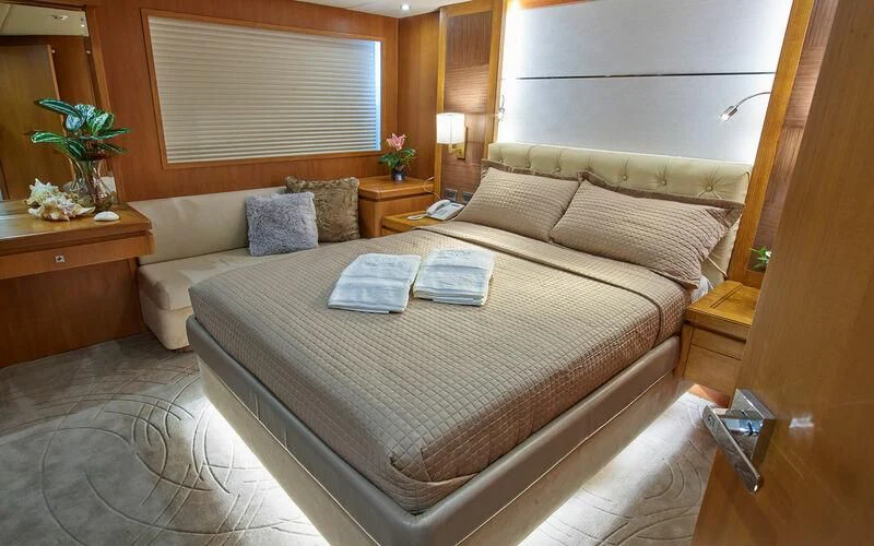a hotel room with a bed aboard ALAIA Yacht for Sale