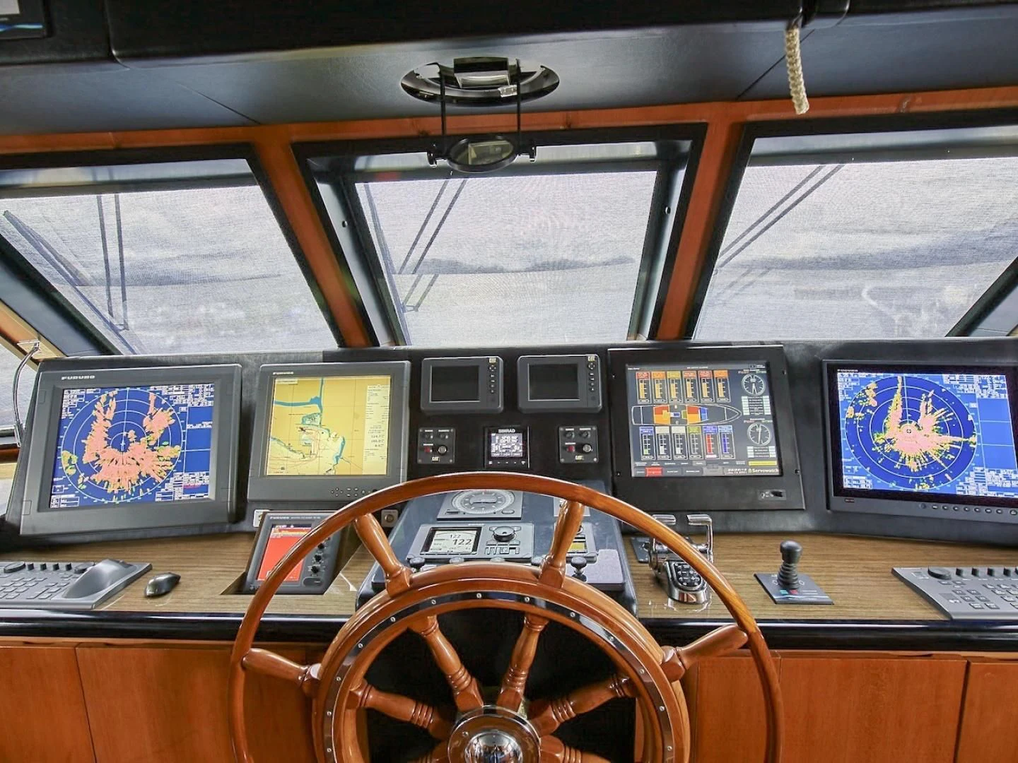 a control room with many monitors aboard ALAIA Yacht for Sale