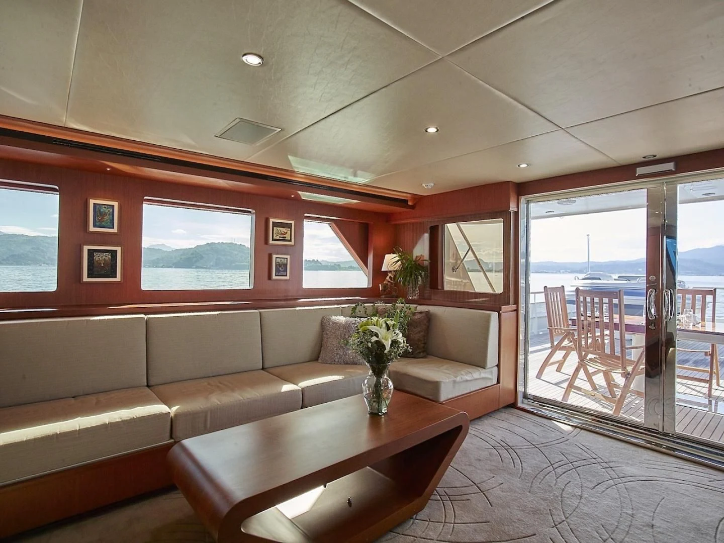 a living room with a couch and a table aboard ALAIA Yacht for Sale
