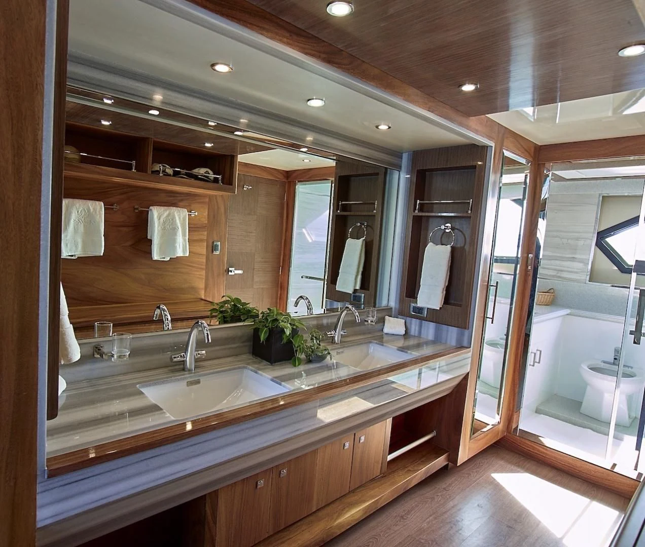 a bathroom with a large mirror aboard ALAIA Yacht for Sale