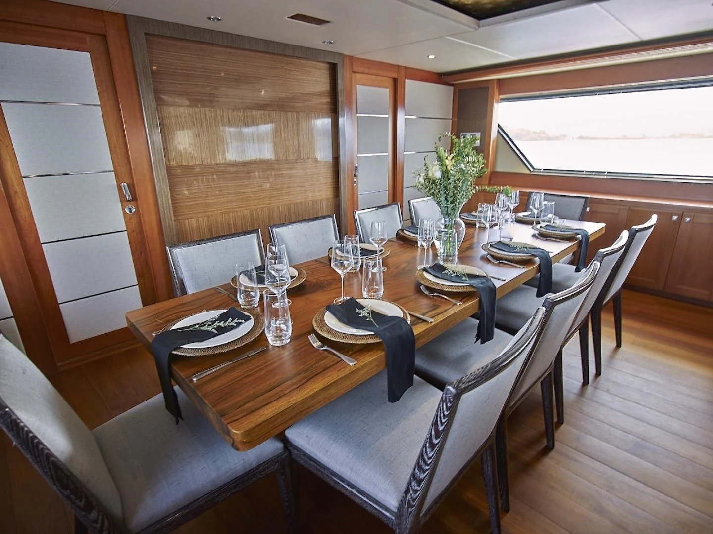a dining table with chairs aboard ALAIA Yacht for Sale