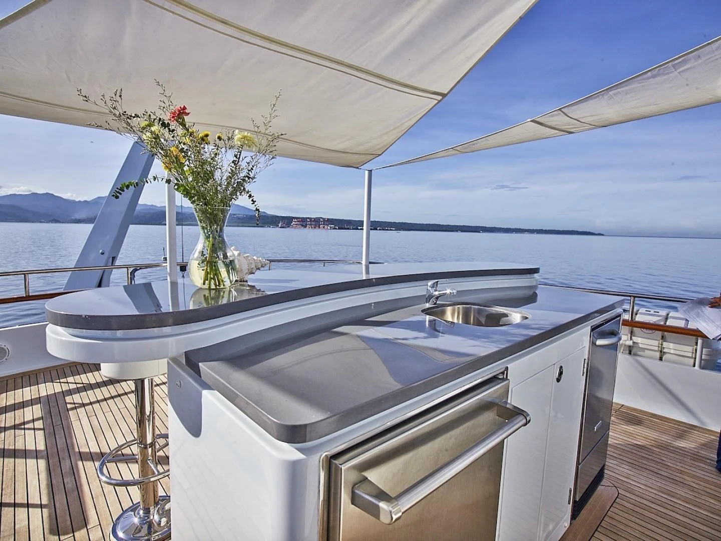 a kitchen with a sink and a plant on the counter aboard ALAIA Yacht for Sale