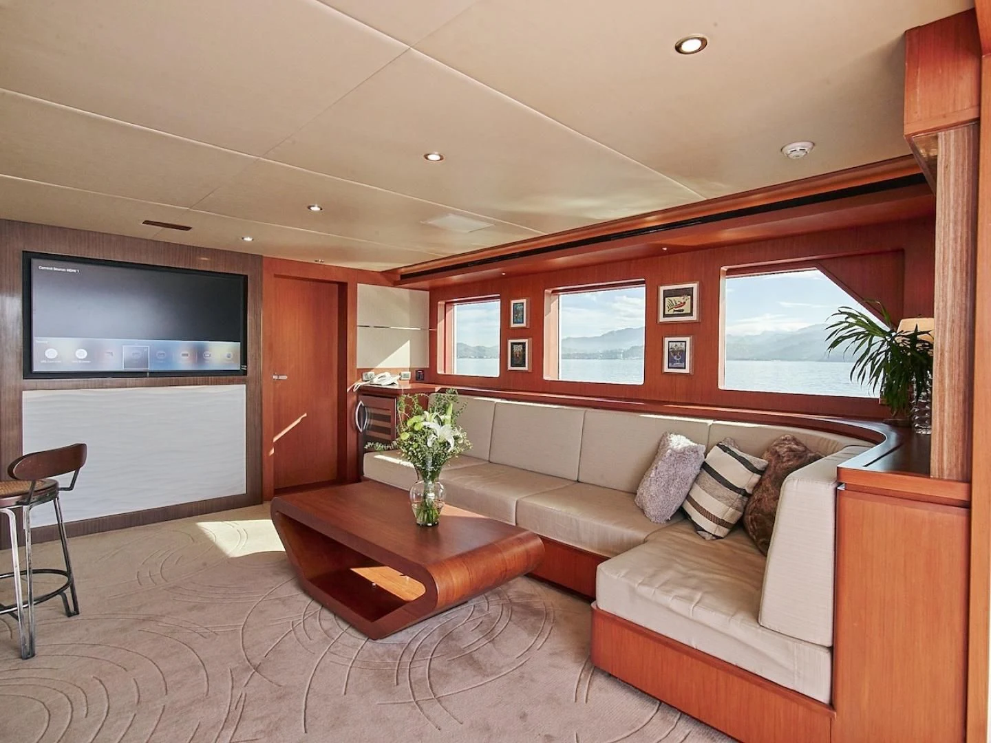 a living room with a couch and a tv aboard ALAIA Yacht for Sale