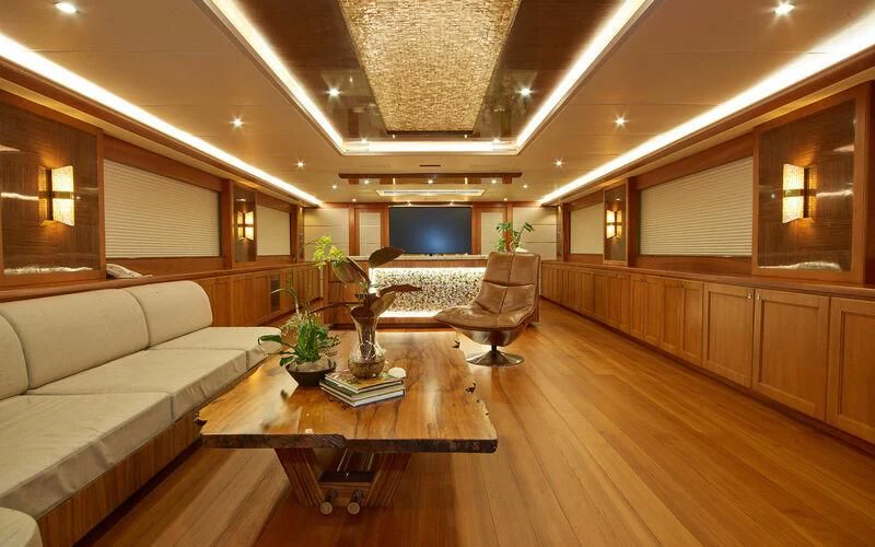 a living room with a couch and a coffee table aboard ALAIA Yacht for Sale