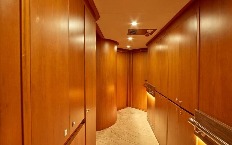 a hallway with wooden cabinets aboard ALAIA Yacht for Sale