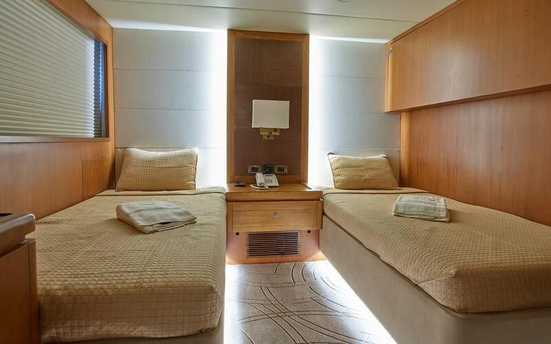 a room with two beds aboard ALAIA Yacht for Sale
