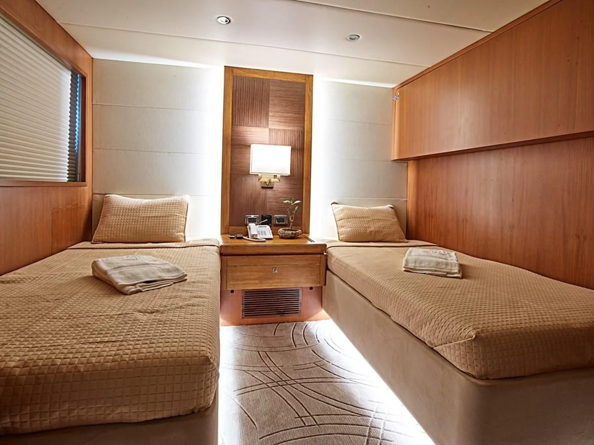 a room with two beds aboard ALAIA Yacht for Sale