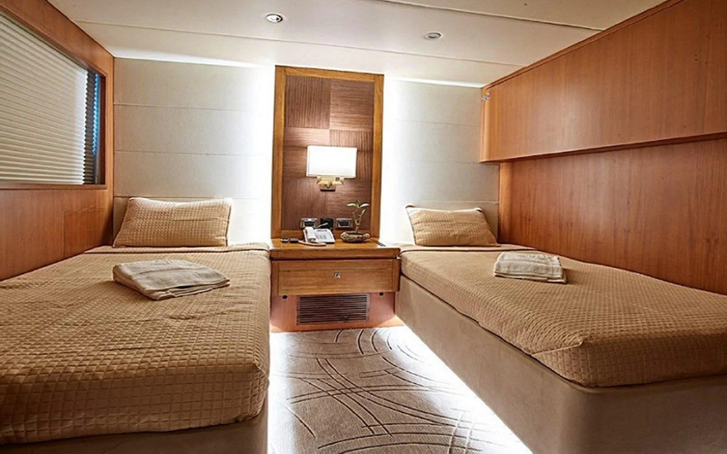 a room with two beds aboard ALAIA Yacht for Sale