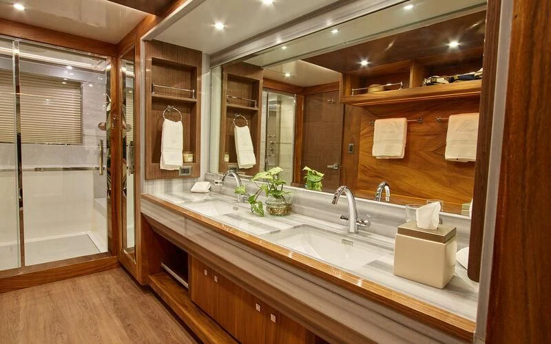 a bathroom with a large mirror aboard ALAIA Yacht for Sale