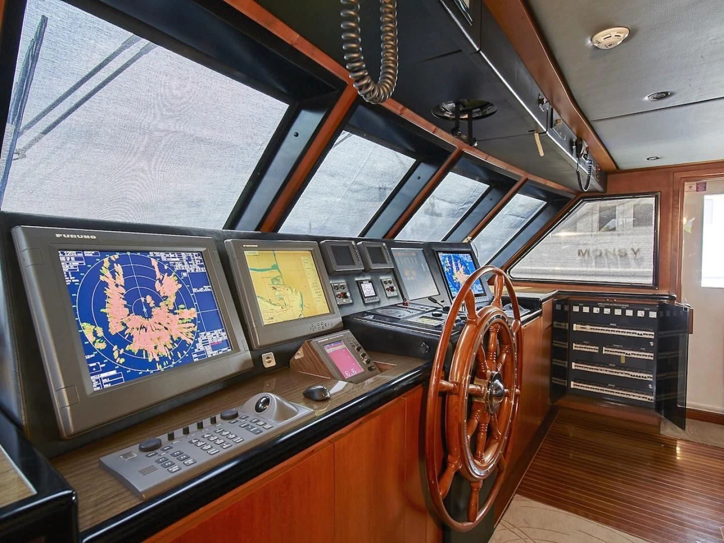 a control panel with a screen and a guitar aboard ALAIA Yacht for Sale