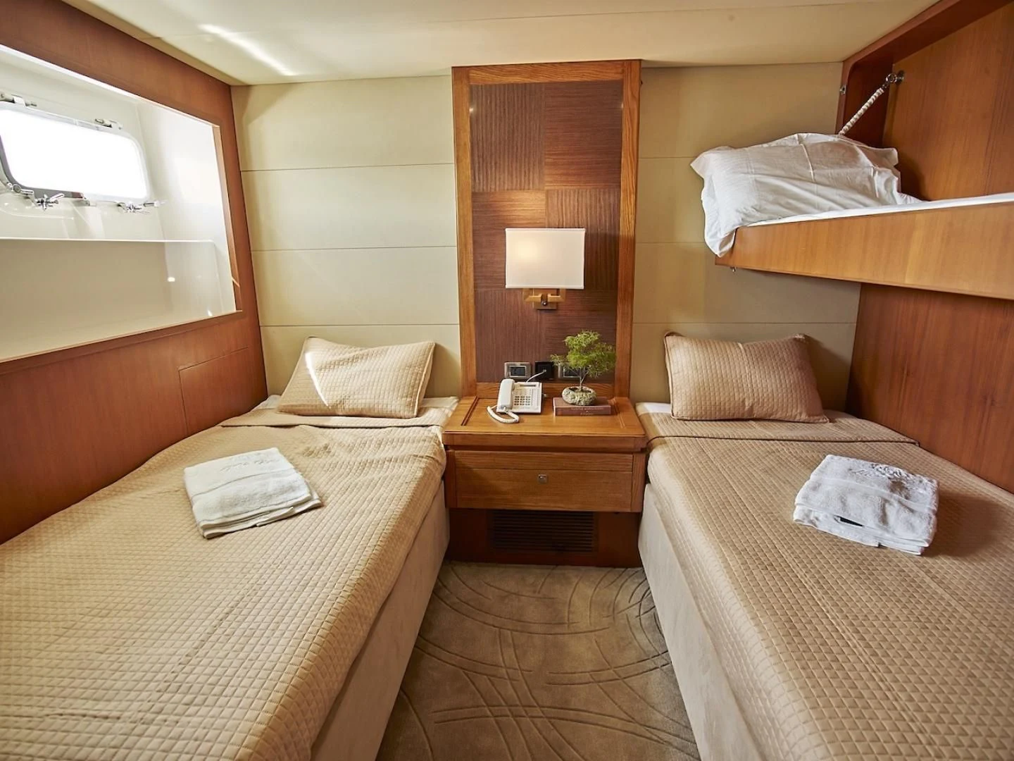 a hotel room with two beds aboard ALAIA Yacht for Sale