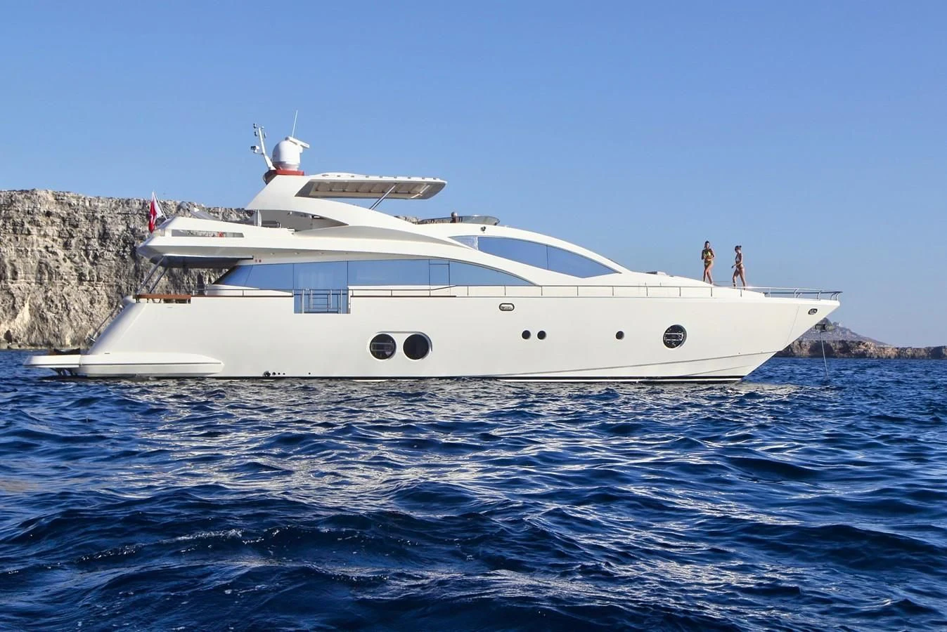 a white yacht in the water aboard SICILIA IV Yacht for Sale
