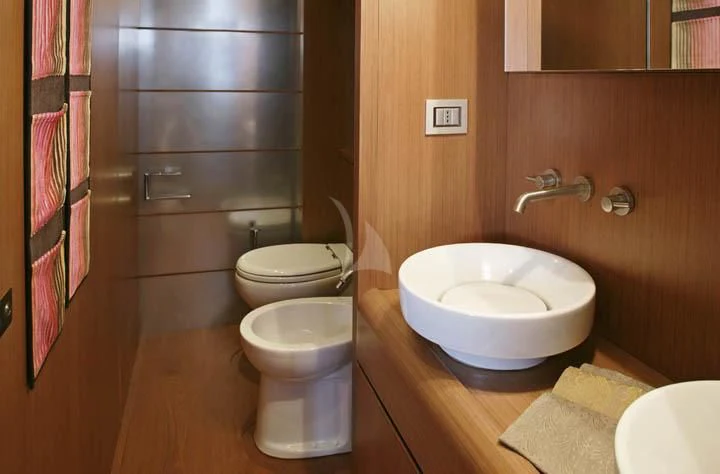 a bathroom with a sink and toilet aboard SICILIA IV Yacht for Sale
