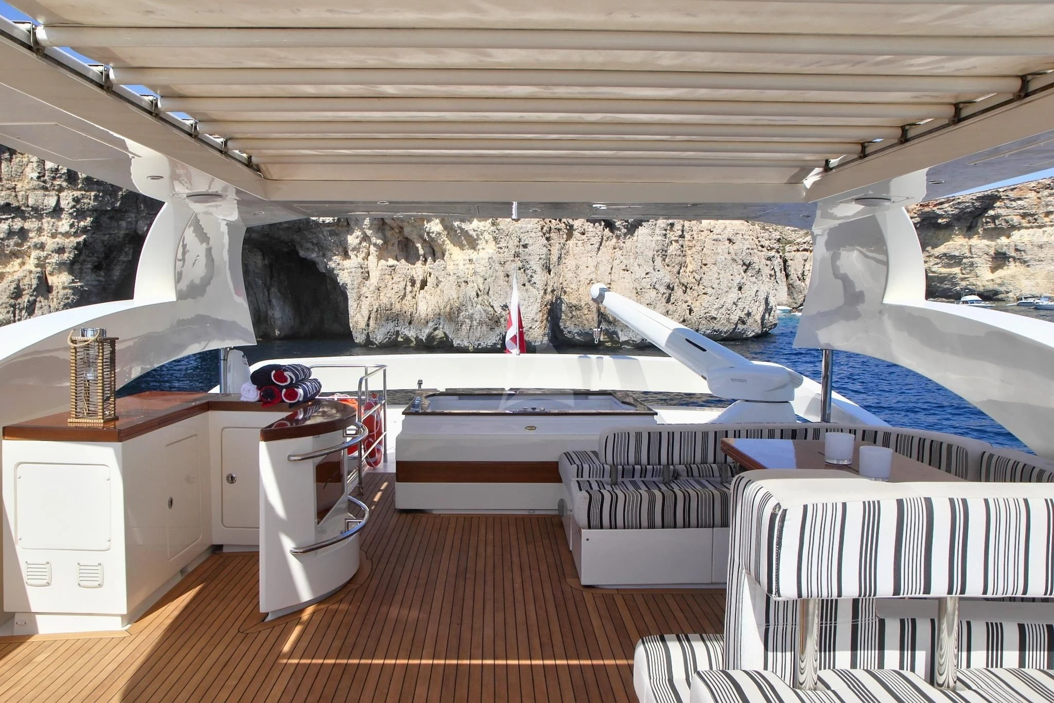 a room with a deck and a pool aboard SICILIA IV Yacht for Sale