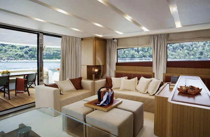 a living room with a large window aboard SICILIA IV Yacht for Sale