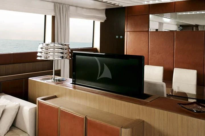 a room with a tv and a couch aboard SICILIA IV Yacht for Sale