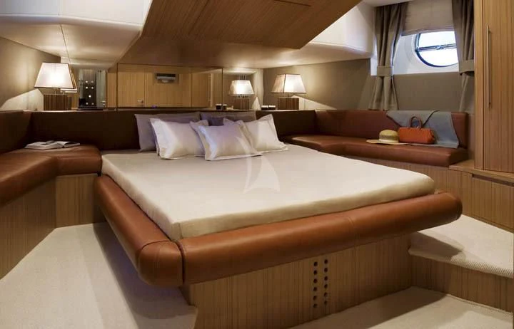 a bed with a white sheet aboard SICILIA IV Yacht for Sale