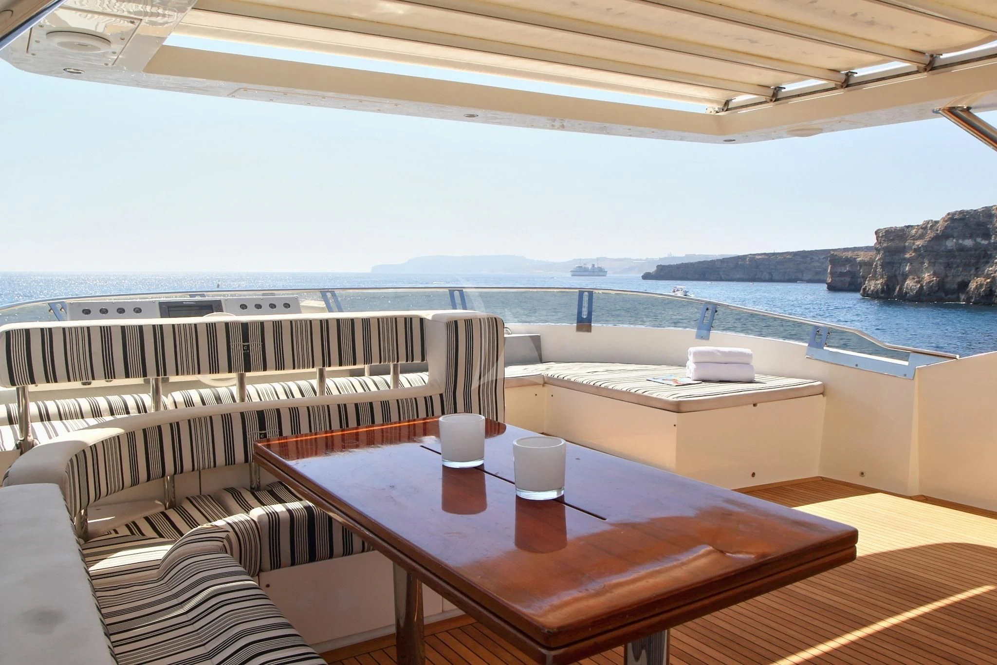 a table and chairs on a boat aboard SICILIA IV Yacht for Sale