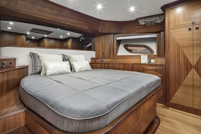 a bed in a room aboard ALECTO Yacht for Sale