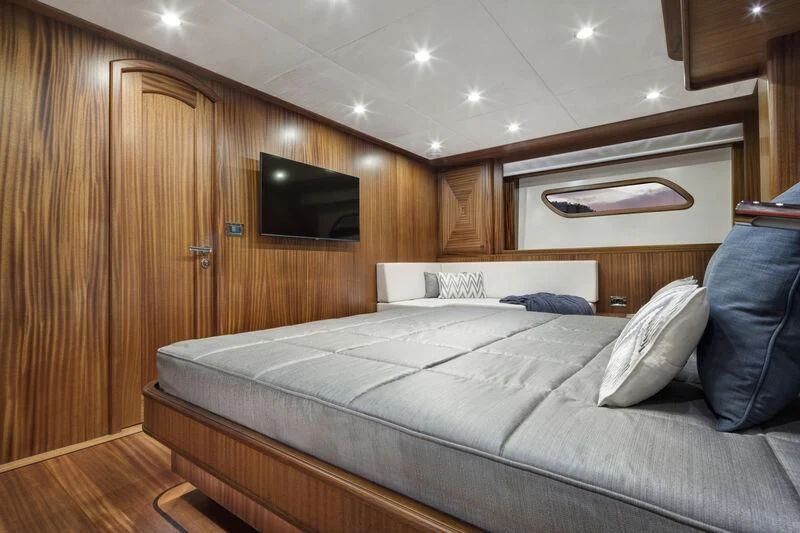 a bed in a room aboard ALECTO Yacht for Sale