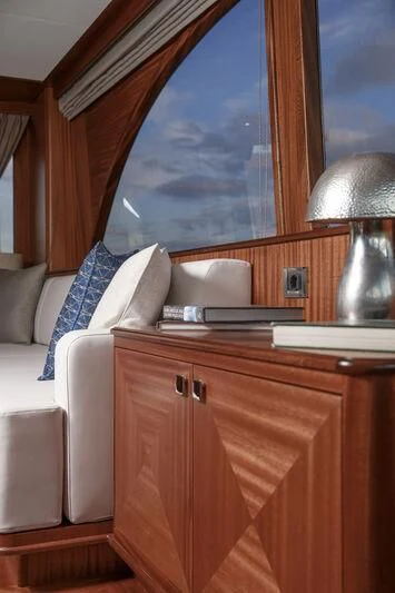 a room with a bed and a desk aboard ALECTO Yacht for Sale