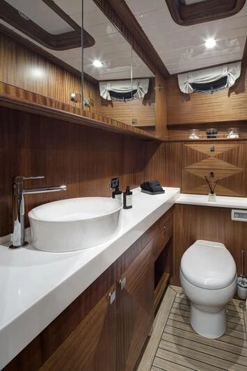 a bathroom with a toilet and sink aboard ALECTO Yacht for Sale