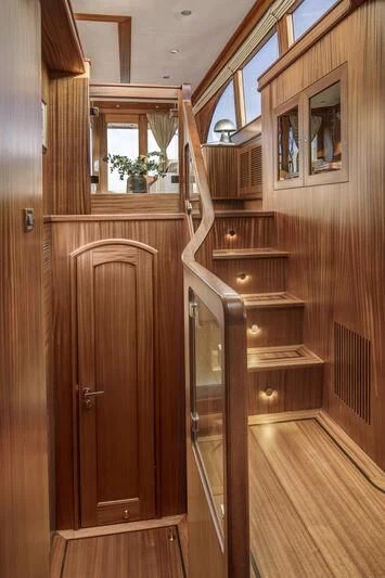 a wooden cabinet in a room aboard ALECTO Yacht for Sale