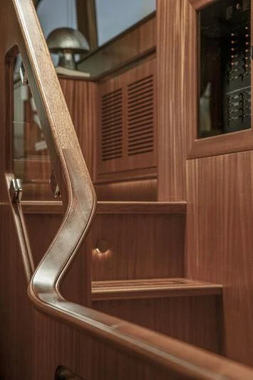 a wooden door with a mirror aboard ALECTO Yacht for Sale