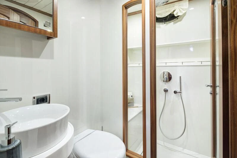 a bathroom with a sink and a shower aboard ALECTO Yacht for Sale