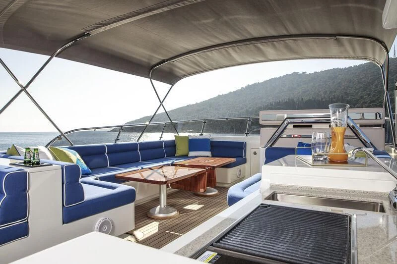 a boat with a glass of beer on the deck aboard ALECTO Yacht for Sale