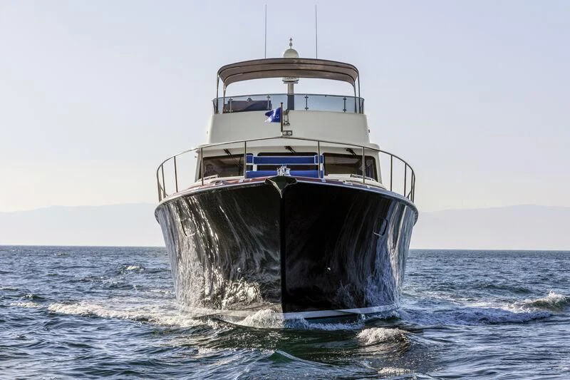 a large ship in the water aboard ALECTO Yacht for Sale