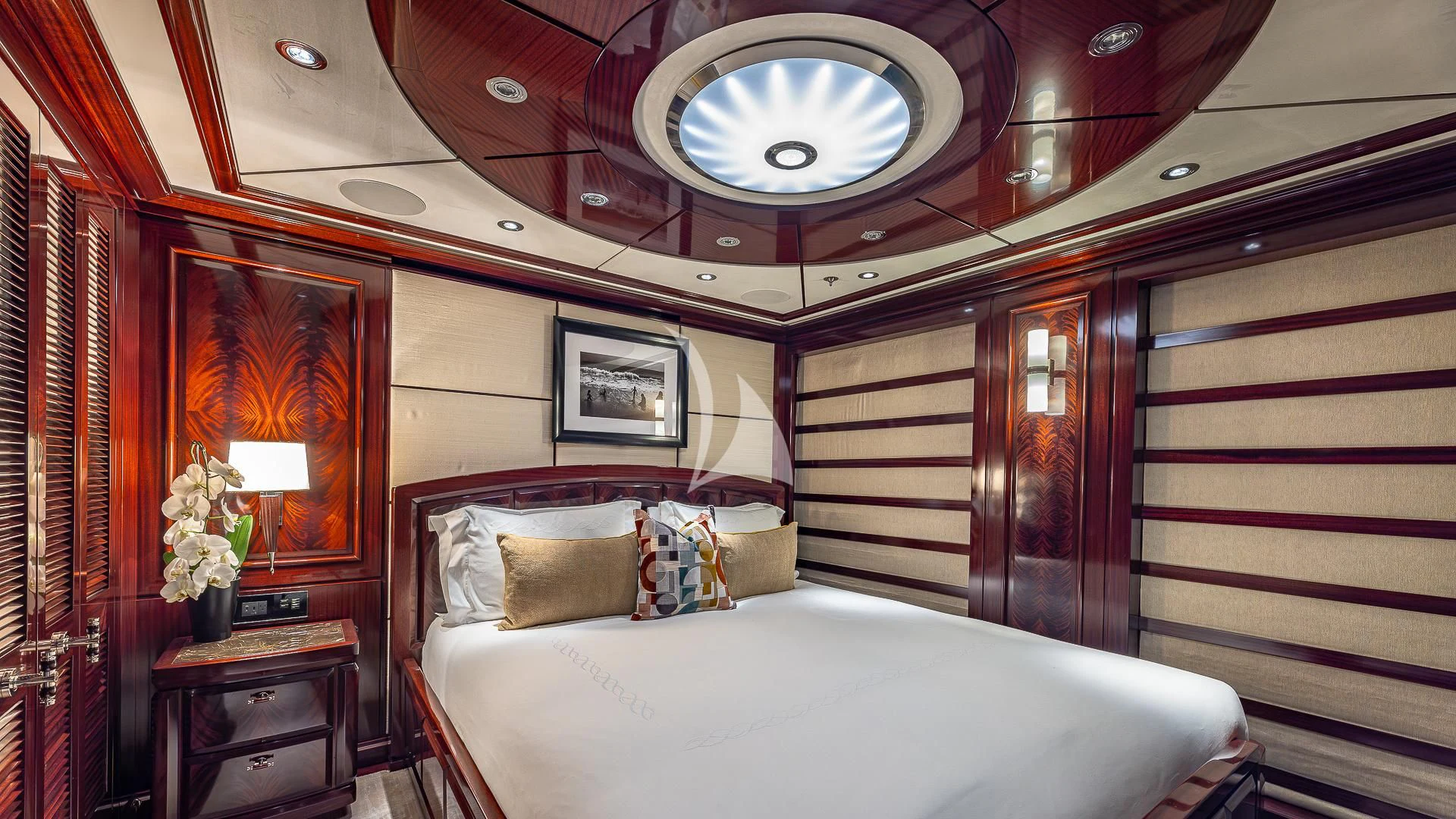 a room with a bed and a mirror aboard ROCK.IT Yacht for Charter