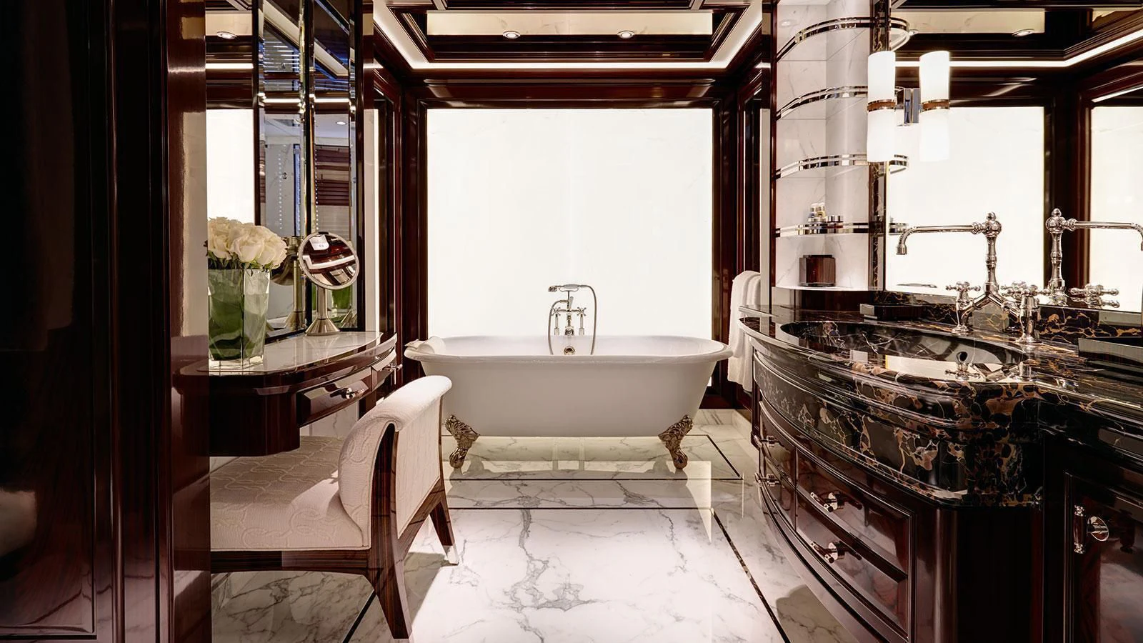 a bathroom with a tub sink and a mirror aboard ROCK.IT Yacht for Charter
