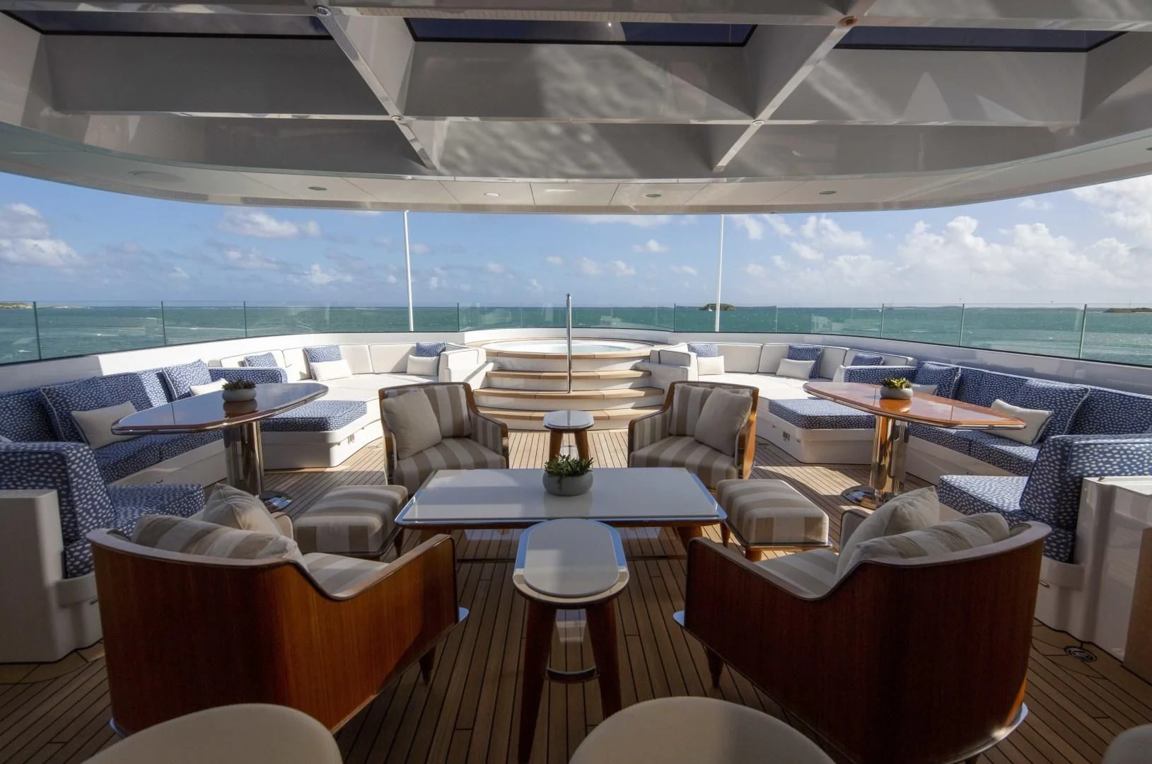 a room with tables and chairs aboard ROCK.IT Yacht for Charter