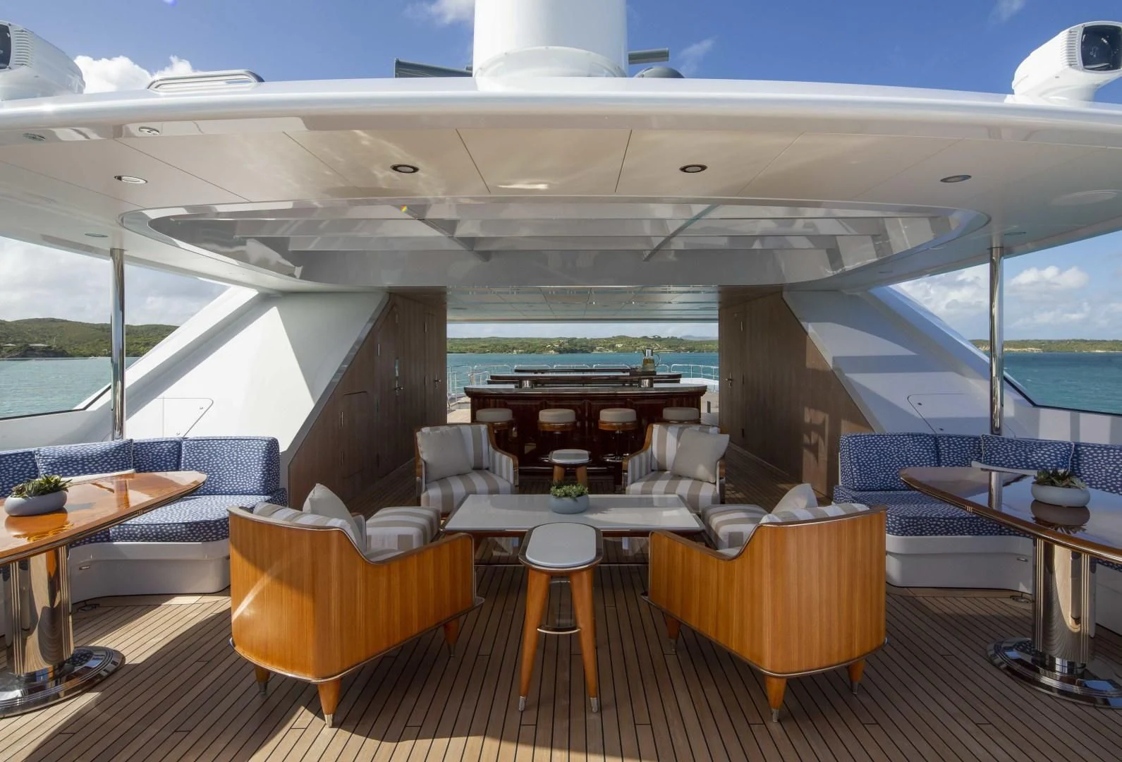 a room with tables and chairs aboard ROCK.IT Yacht for Charter