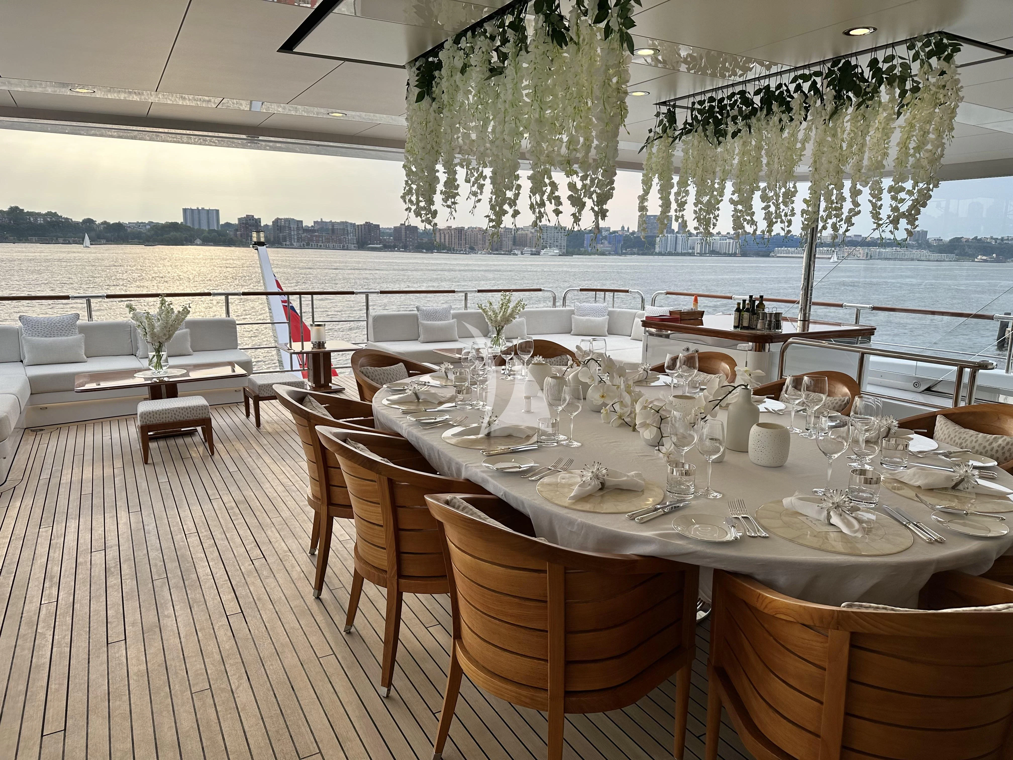 tables set for a dinner party aboard ROCK.IT Yacht for Charter