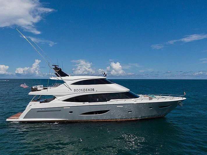 a white yacht in the water aboard OBSESSION Yacht for Sale