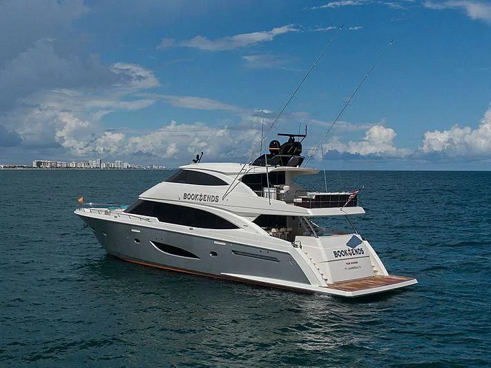 a white yacht in the water aboard OBSESSION Yacht for Sale