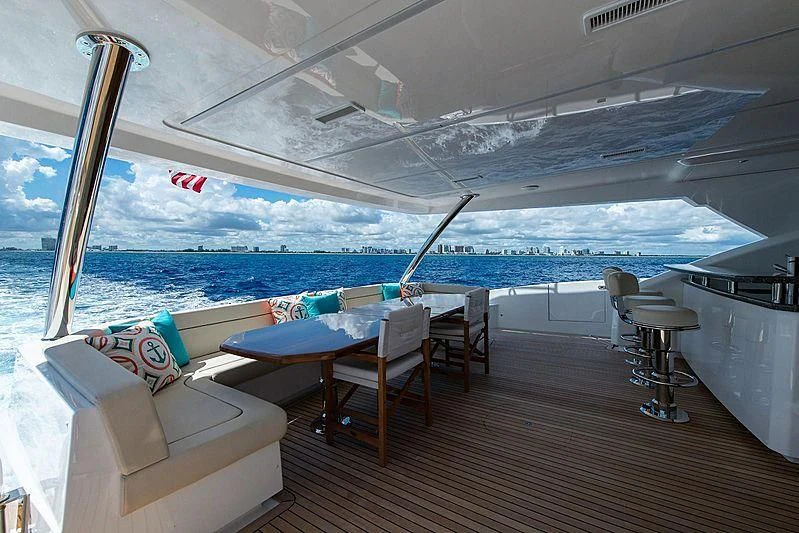 a room with a table and chairs aboard OBSESSION Yacht for Sale
